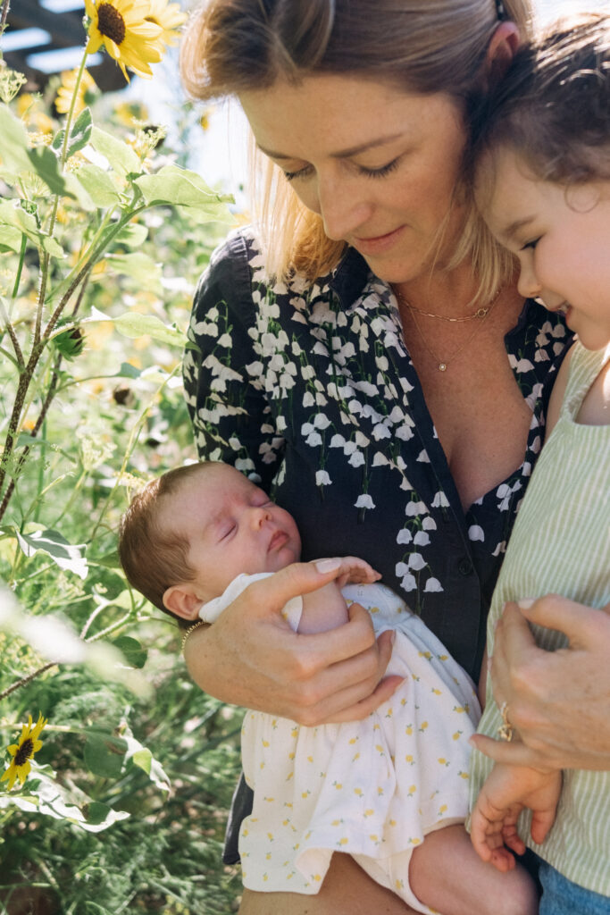 mom with new baby and daughter
