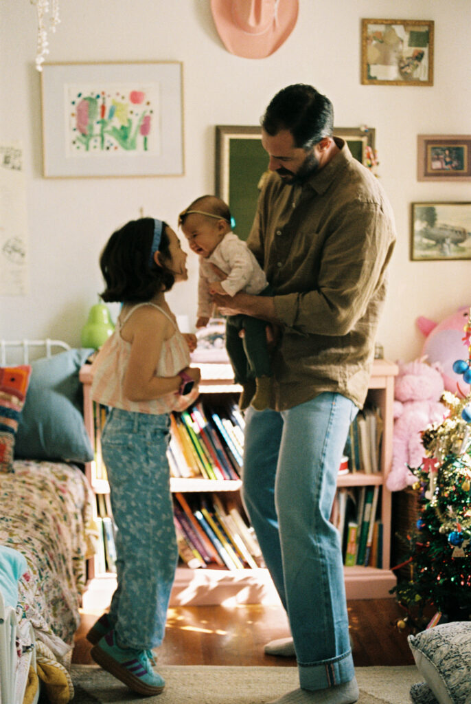 film photo of a family in child's bedroom